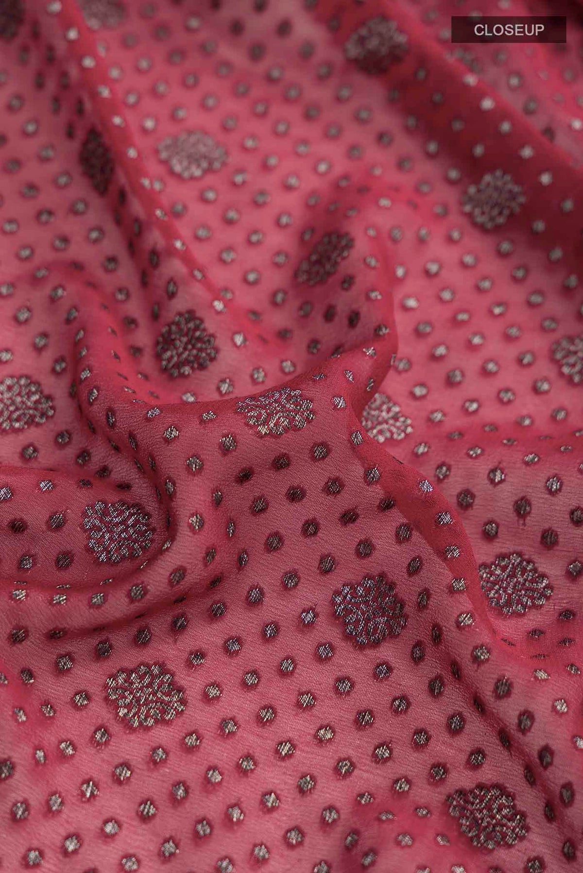 Close up of Maroon Banarasi Georgette Saree with Zari Butta on the body and Zari Border displaying folds