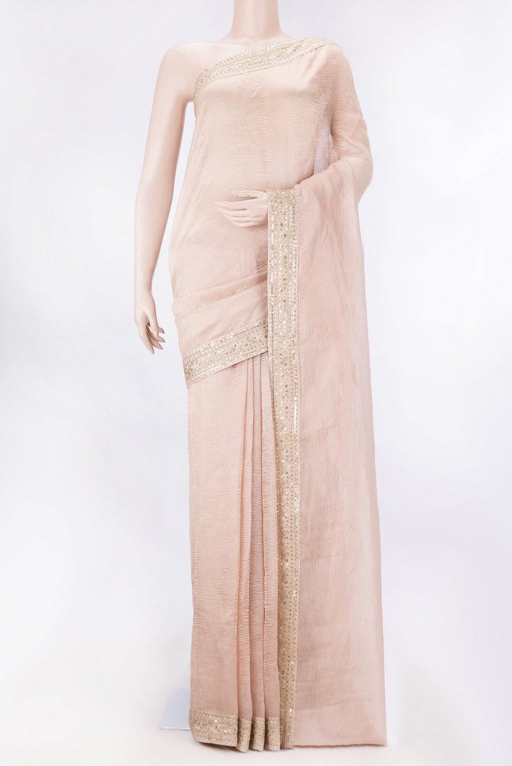 Golden Peach Tissue Silk Saree with Plain Body and Embroidery Border displayed on a mannequin