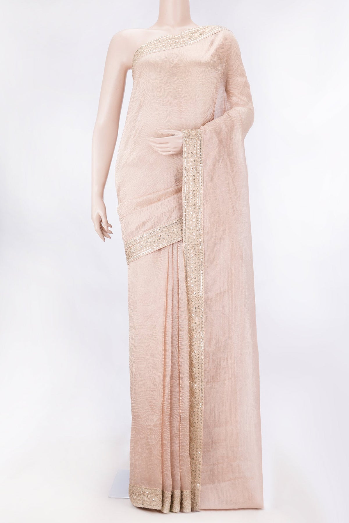 Golden Peach Tissue Silk Saree with Plain Body and Embroidery Border displayed on a mannequin