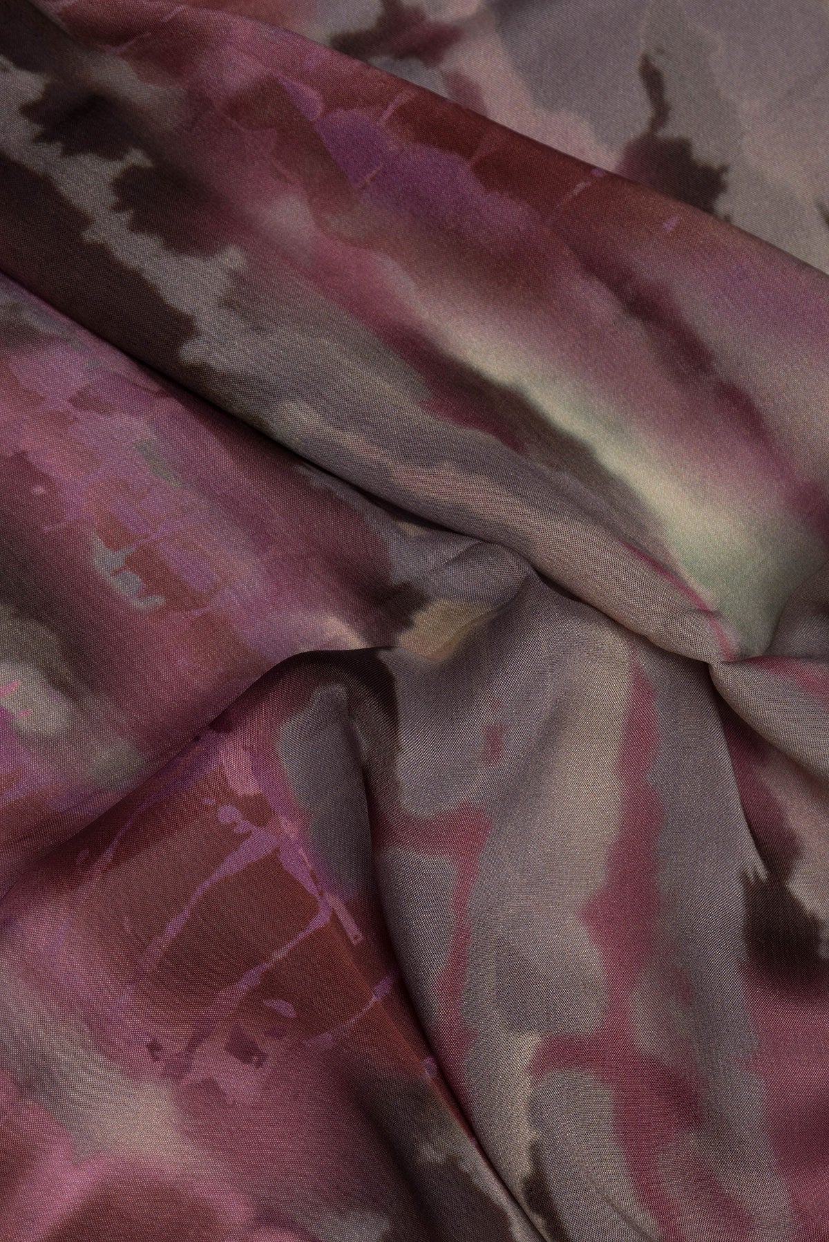 Close up of Brown Dual Tone Crepe Saree with Printed design on the body and Without Border.  displaying folds