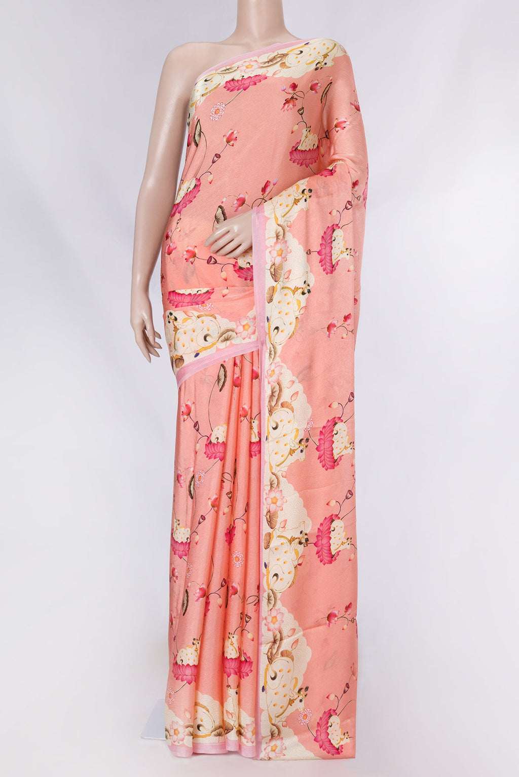 Peach Dual Tone Mysore Crepe Saree with Printed design on the body and Printed Border displayed on a mannequin