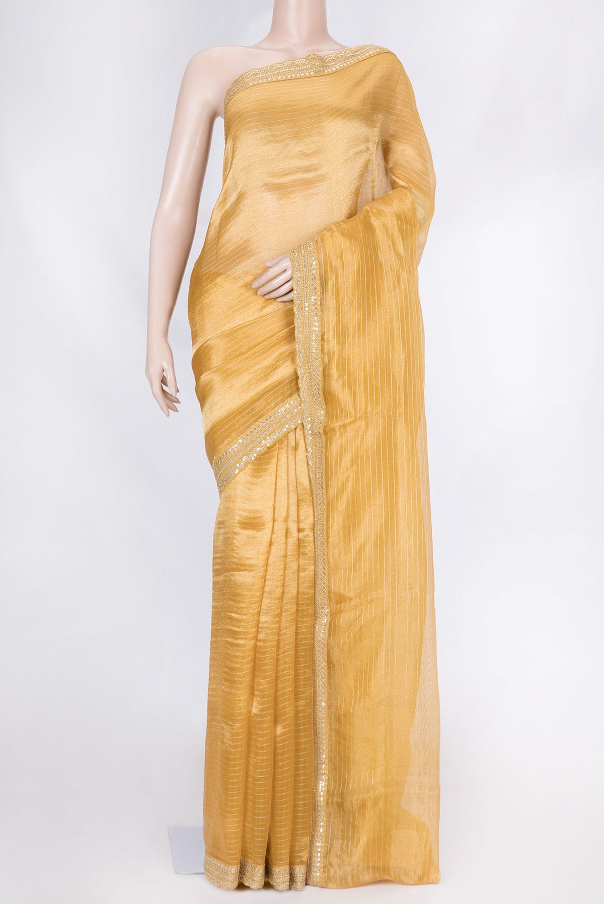 Gold Organza Silk Saree with Stripes on the body and Embroidery Border displayed on a mannequin