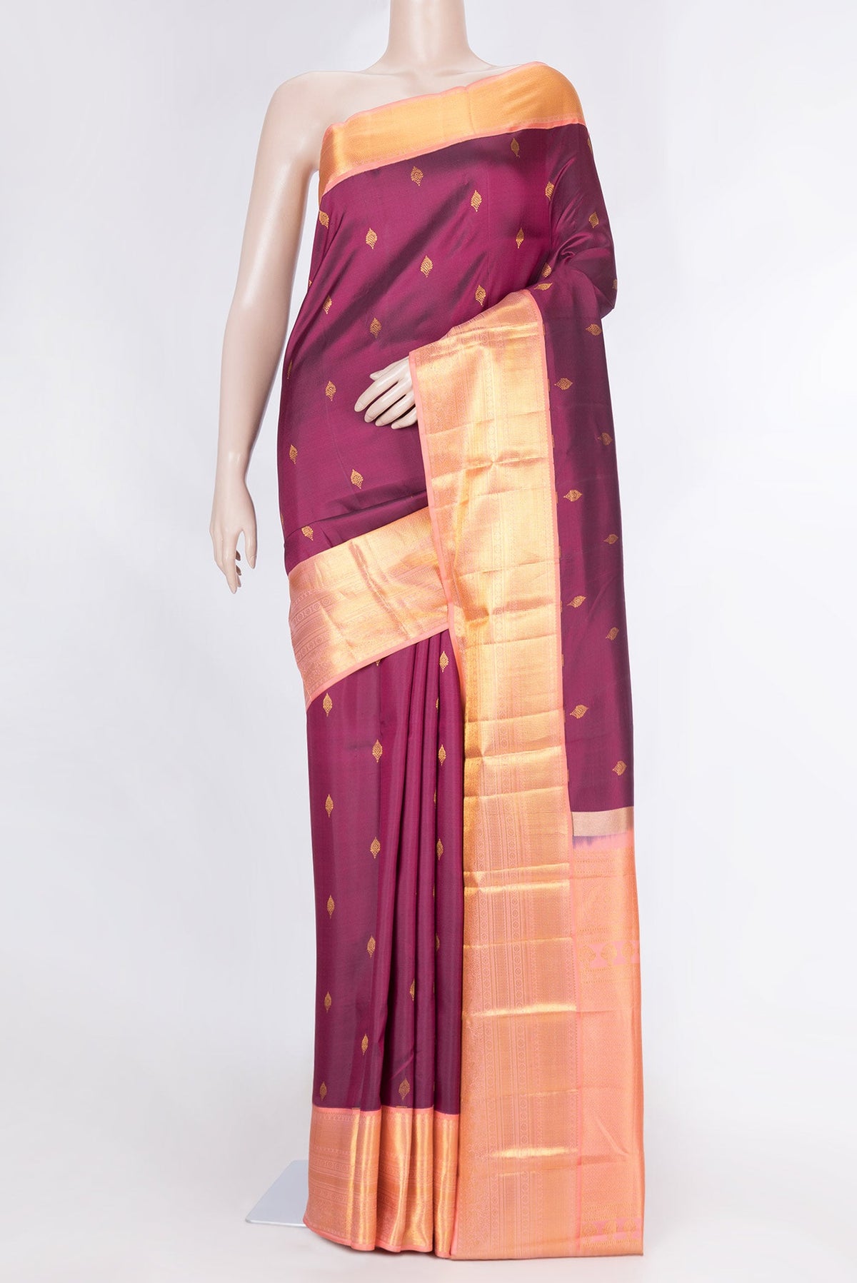Magenta Dual Tone Kanchipuram Saree with Zari Butta on the body and Zari Border displayed on a mannequin