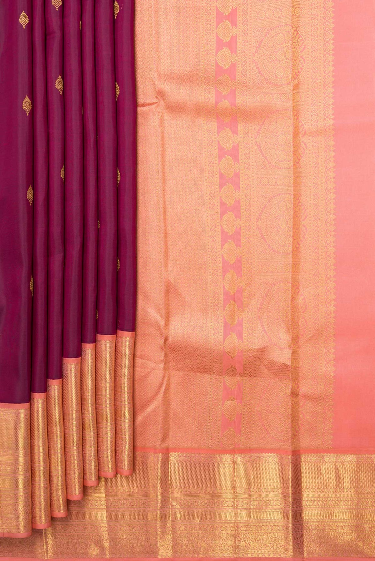 Pleats and pallu of Magenta Dual Tone Kanchipuram Saree with Zari Butta on the body and Zari Border