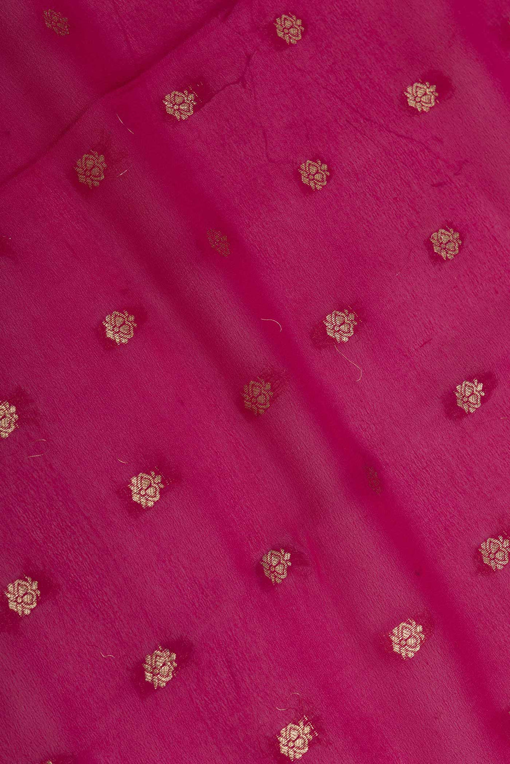 Close up of Pink Dual Tone Georgette Saree with Zari Butta on the body and Zari Border displaying folds