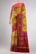 Mehandi Green Dual Tone Rajkot Patola Silk Saree with Ikat Print on the body and Ikat Border displayed on a mannequin