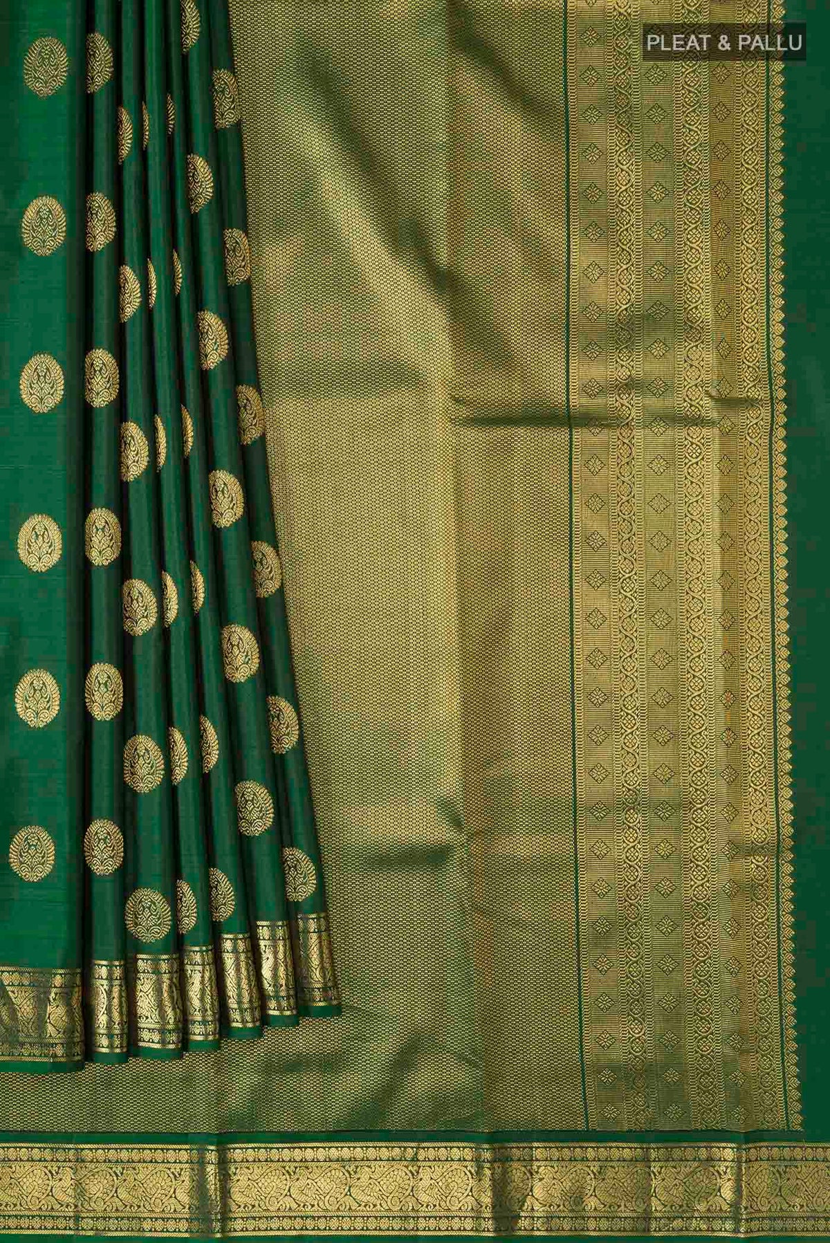 Pleats and pallu of Green Kanchipuram Silk Saree with Zari Butta on the body and Zari Border