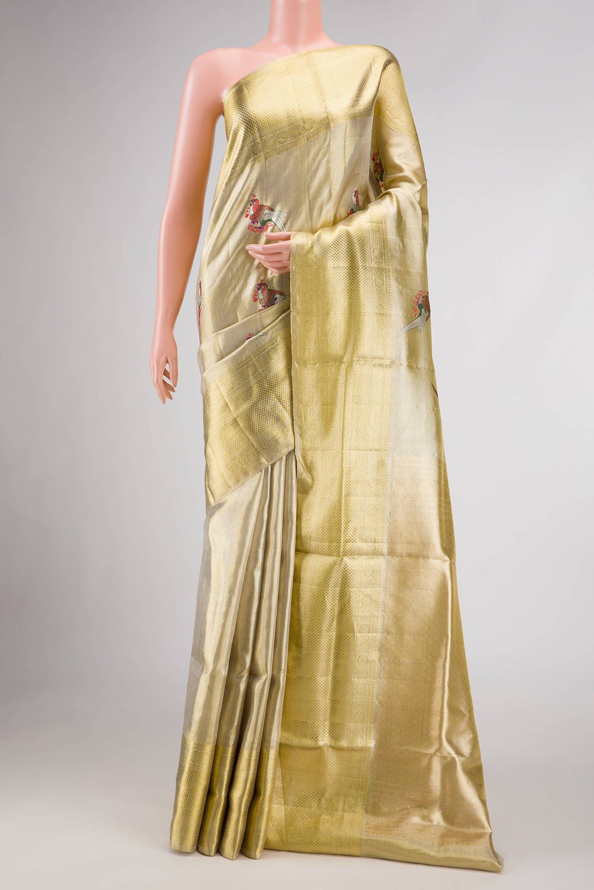 Gold Dual Tone Kanjivaram Tissue Silk Saree with Zari Brocade on the body and Zari Border.  displayed on a mannequin