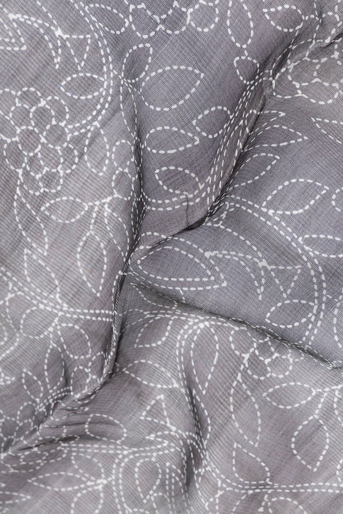 Close up of Black Dual Tone Tussar Silk Saree with Printed design on the body and Plain Border.  displaying folds
