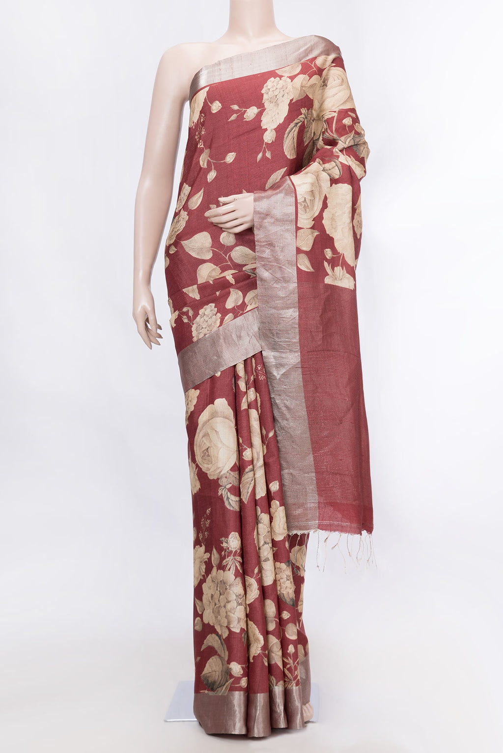 Maroon Dual Tone Tussar Silk SareePrinted design on the body and Zari Border displayed on a mannequin