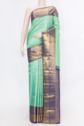 Sea Green Dual Tone Kanchipuram Silk Saree with Zari Brocade on the body and Zari Border displayed on a mannequin