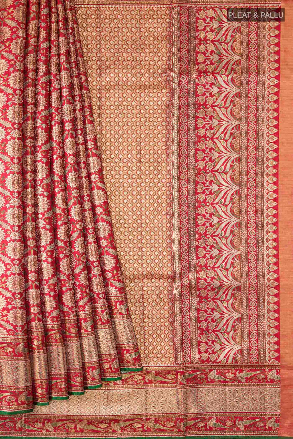 Pleats and pallu of Red Kanchipuram Silk Saree with Zari Brocade on the body and Zari Border