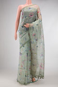 Green Dual Tone Organza Silk Saree with Printed design on the body and Printed Border.  displayed on a mannequin
