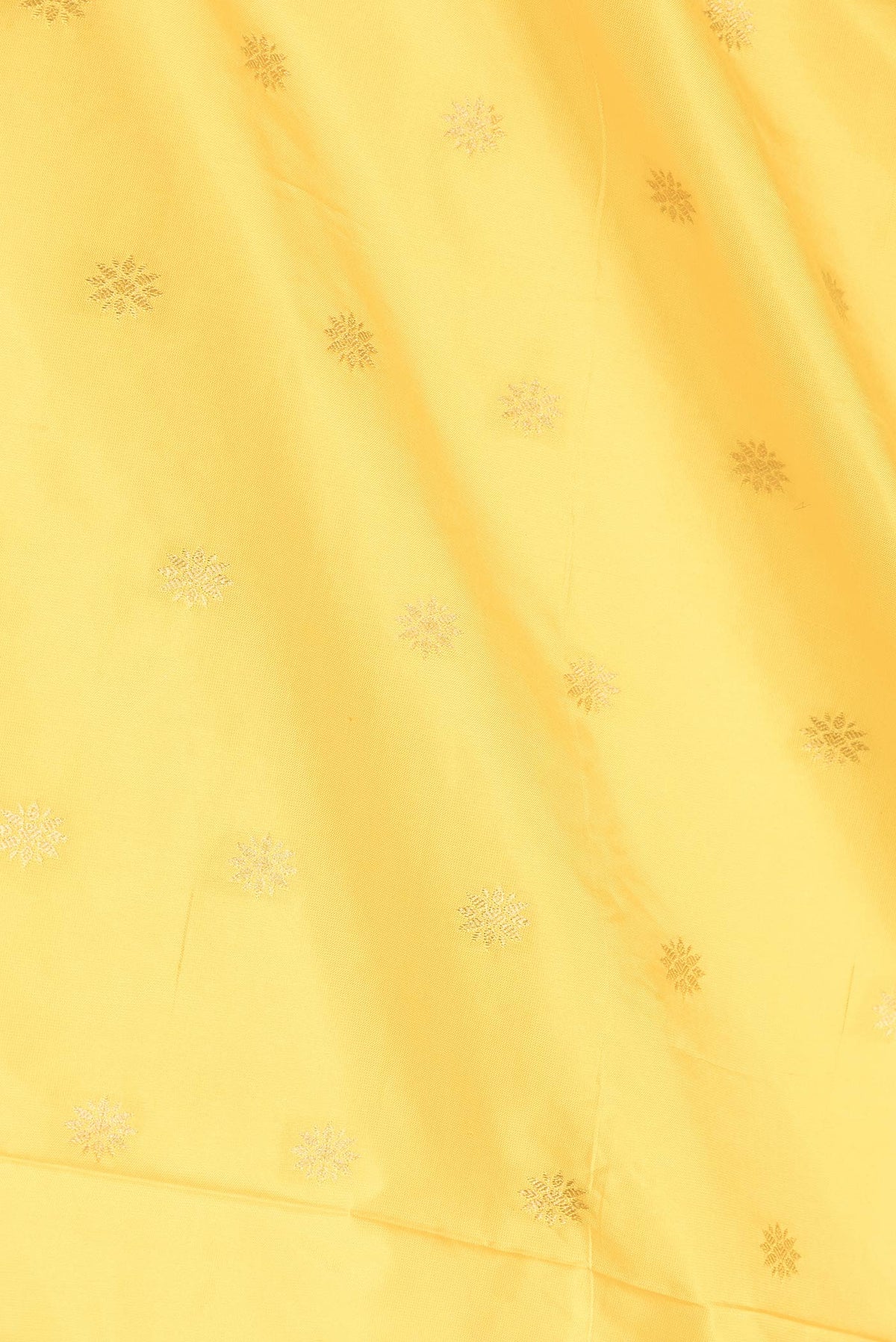 Close up of Yellow Dual Tone Paithani Silk Saree with Zari Butta on the body and Paithani Border displaying folds