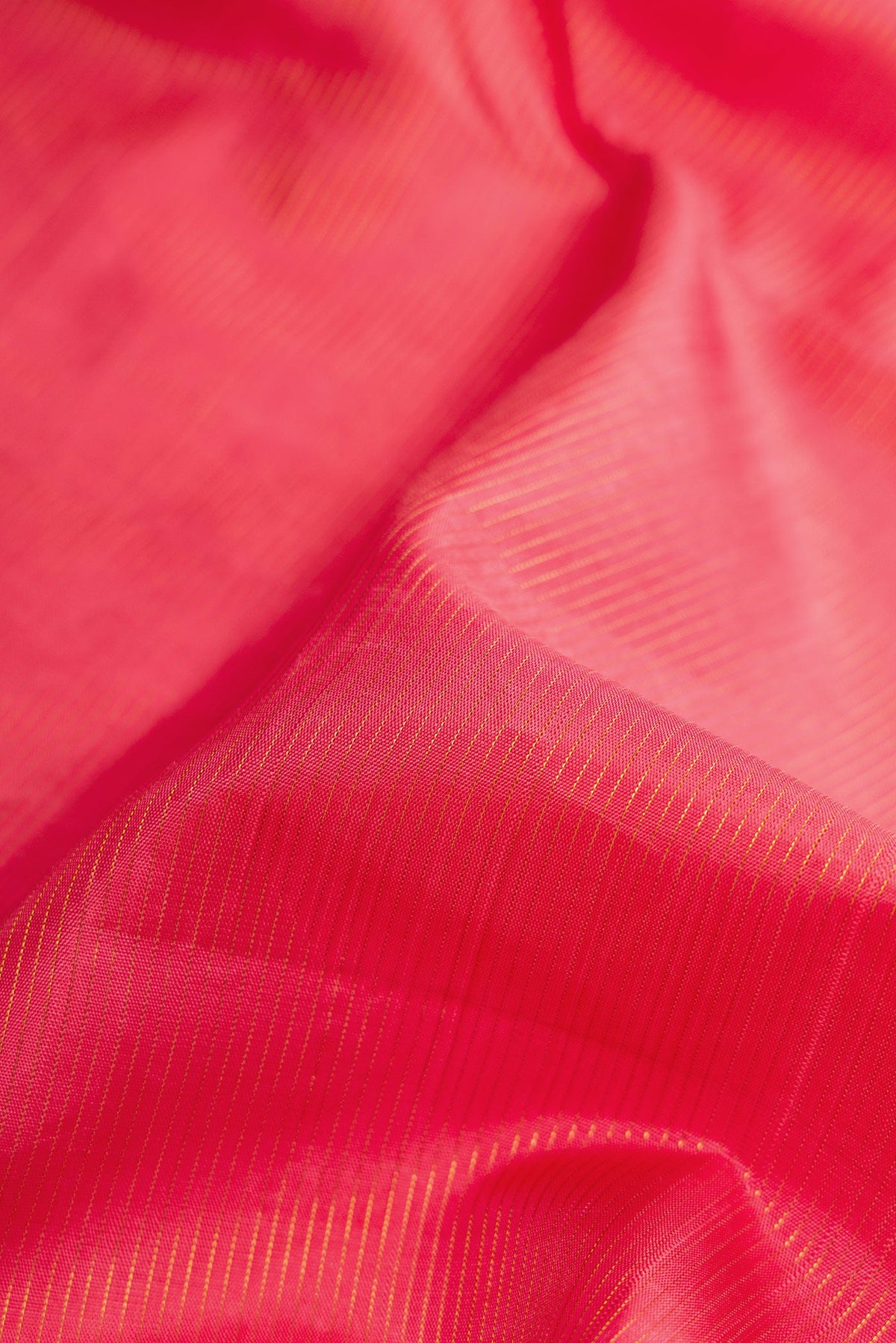 Close up of Pure Silk Pure Zari Pink Dual Tone Kanchipuram Nine Yards Saree with Stripes on the body and Zari Border.  displaying folds