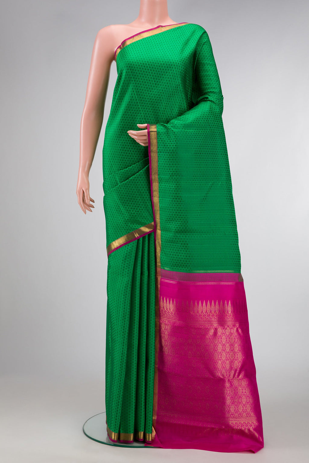 Green Dual Tone Kanchipuram Silk Saree with Jacquard design on the body and Zari Border.  displayed on a mannequin