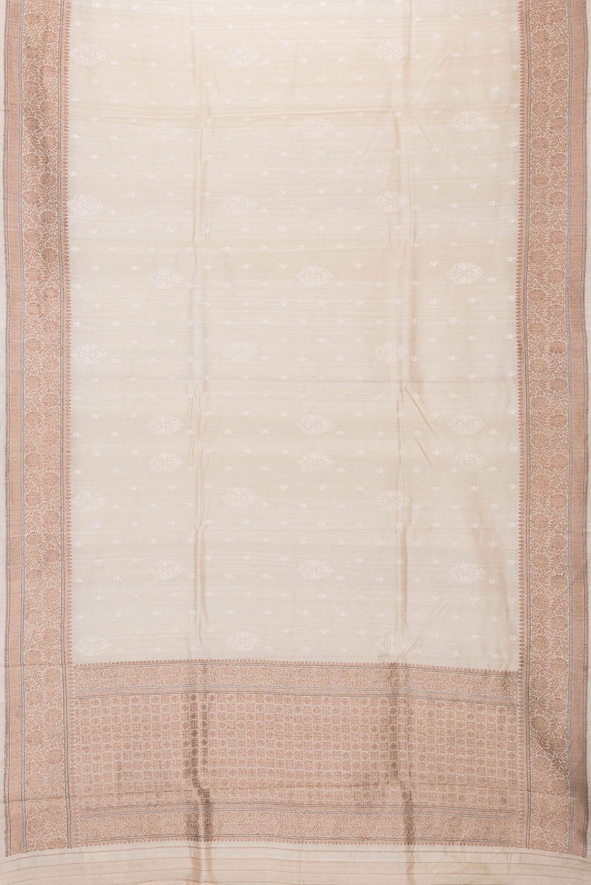 Flat view of Beige Dual Tone Tussar Silk Saree with Embroidery on the body and Zari Border. 
