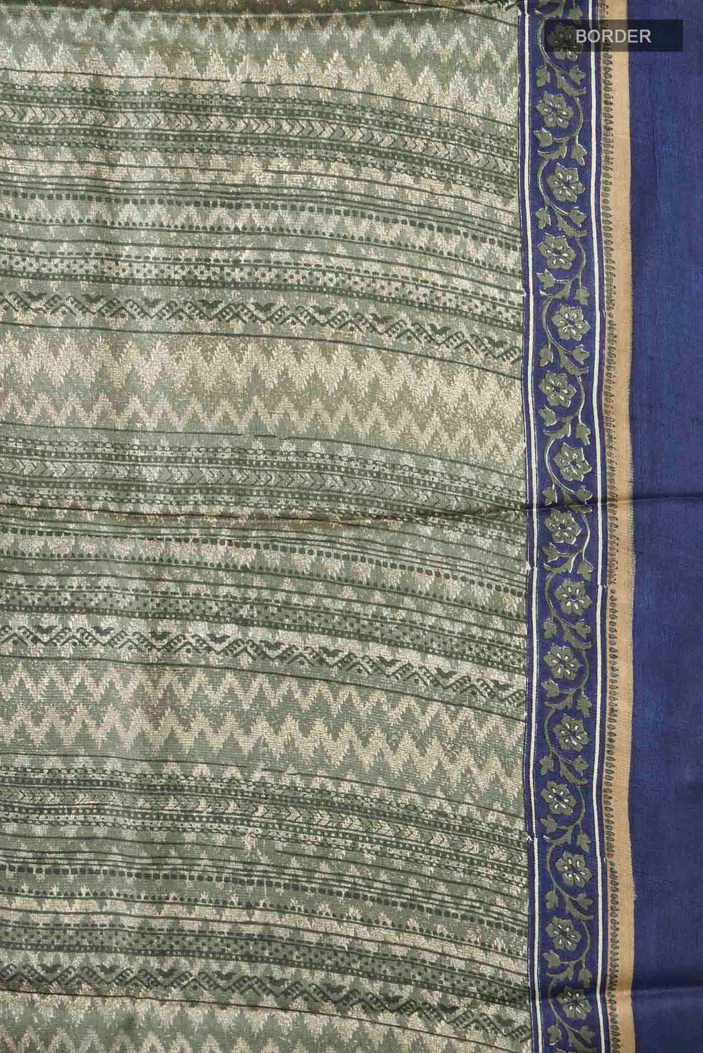 Border image of Green Tussar Silk Saree with Printed design on the body and Plain Border