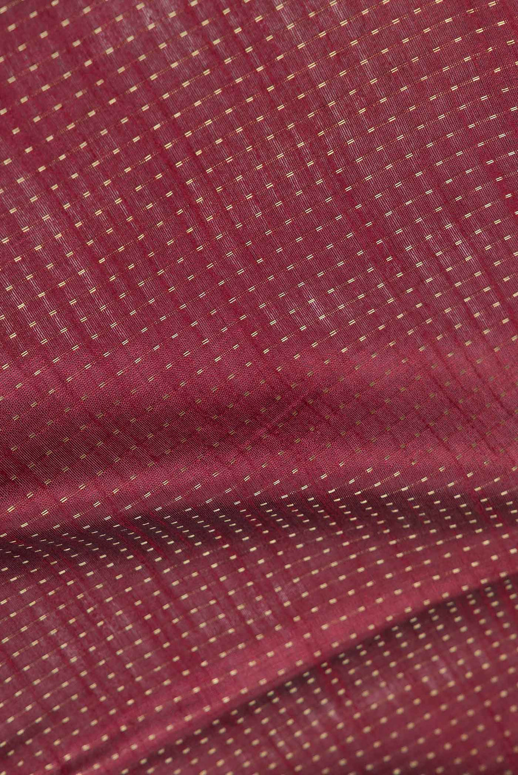 Close up of Maroon Dual Tone Tussar Saree with Stripes on the body and Embroidery Border displaying folds