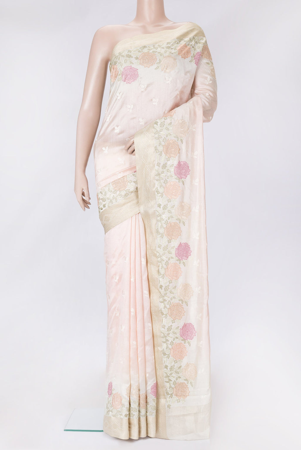 Rose Gold Dual Tone Tussar Silk Saree with Embroidery on the body and Zari Border.  displayed on a mannequin
