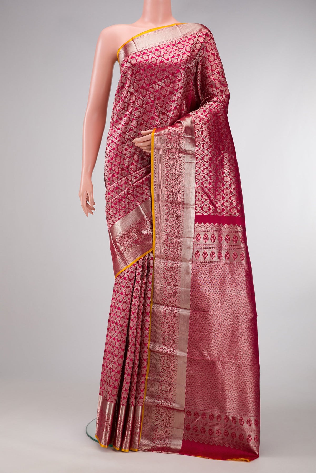 Pink Dual Tone Kanjivaram Silk Saree with Zari Brocade on the body and Zari Border.  displayed on a mannequin