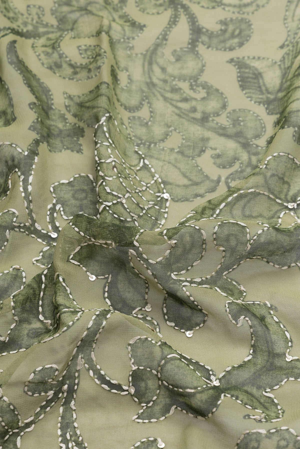 Close up of Green Dual Tone Mysore Georgette Saree with Embroidery on the body and Embroidery Border.  displaying folds