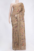 Beige Dual Tone Tussar Saree with kalamkari Print on the body and Zari Border.  displayed on a mannequin