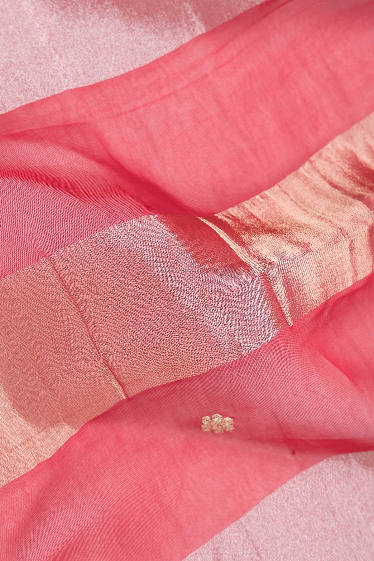 Close up of Red Dual Tone Banarasi Georgette Saree with Stripes on the body and Embroidery Border.  displaying folds