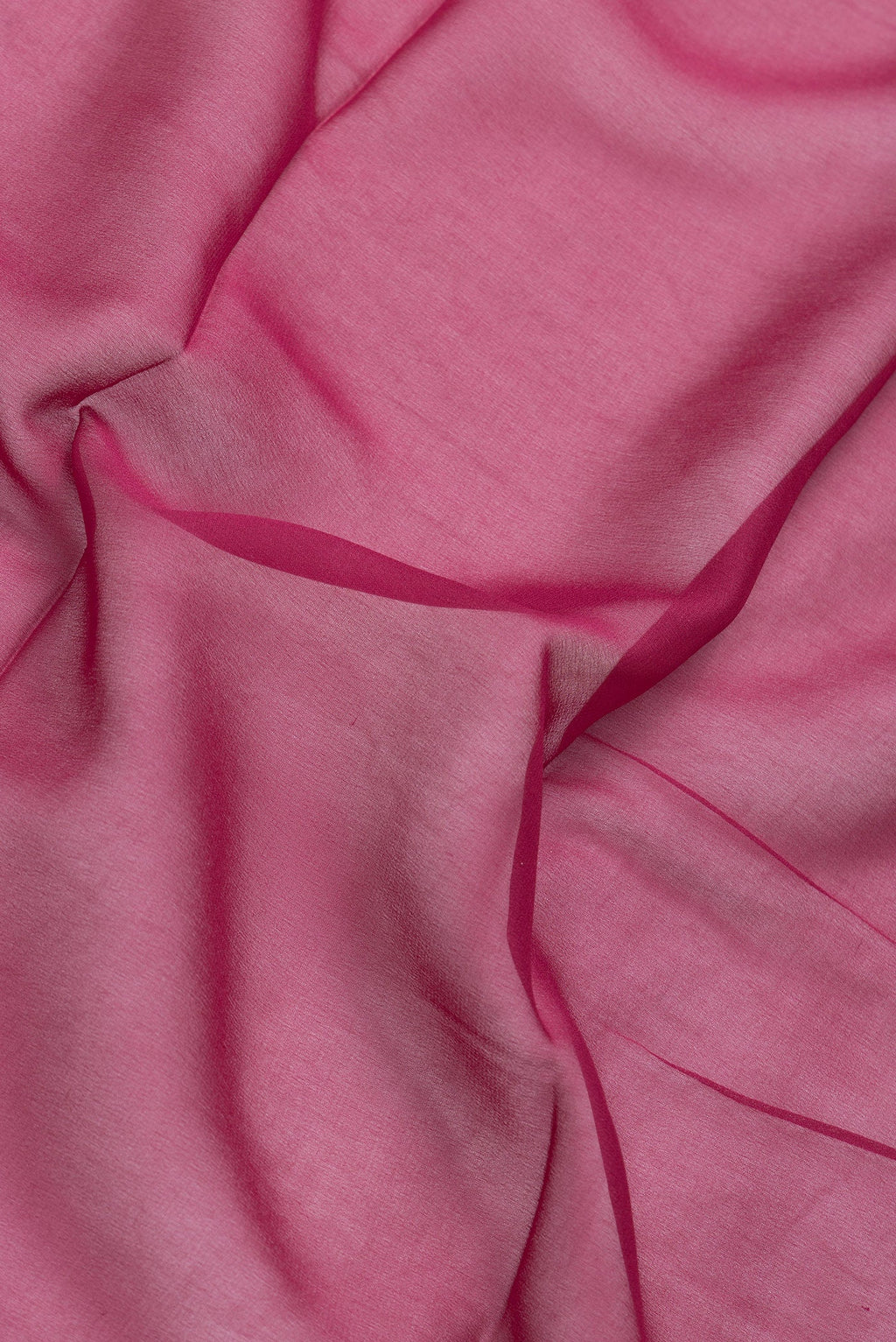Close up of Magenta Dual Tone Mysore Georgette Saree with Plain Body and Temple Border.  displaying folds
