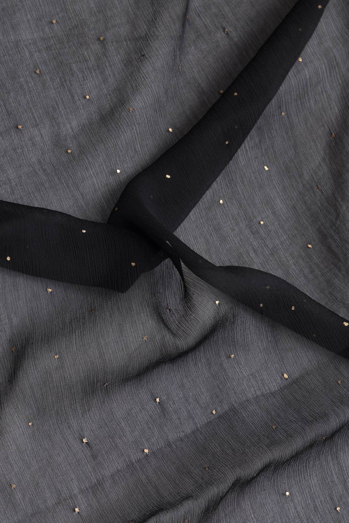 Close up of Black Dual Tone Mysore Chiffon Saree with Embroidery on the body and Embroidery Border.  displaying folds