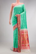 Sea Green Dual Tone Bandhani Silk Saree with Bandhani Print on the body and Zari Border.  displayed on a mannequin