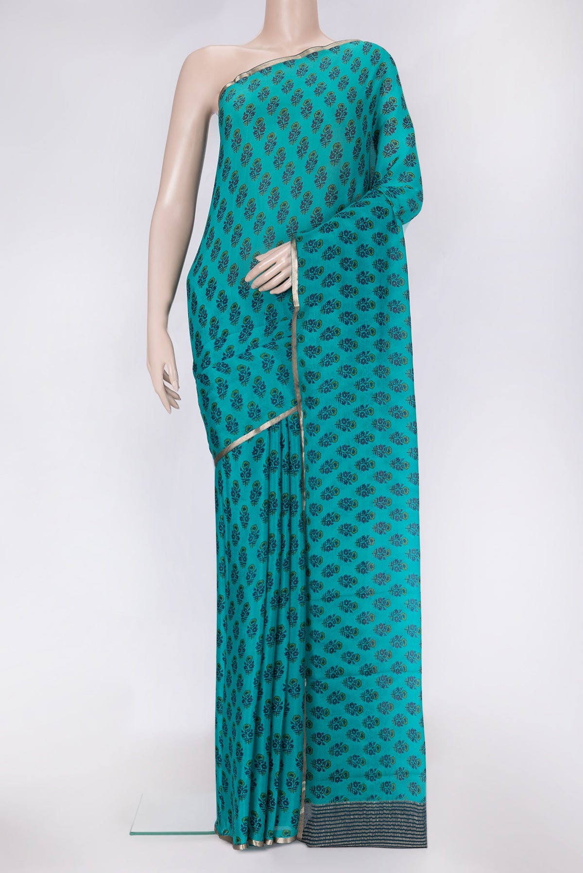 Sky Blue Dual Tone Mysore Chiffon Saree with Printed design on the body and Thin Zari Line.  displayed on a mannequin
