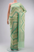 Green Banarasi Georgette Saree with Zari Butta on the body and Zari Border displayed on a mannequin
