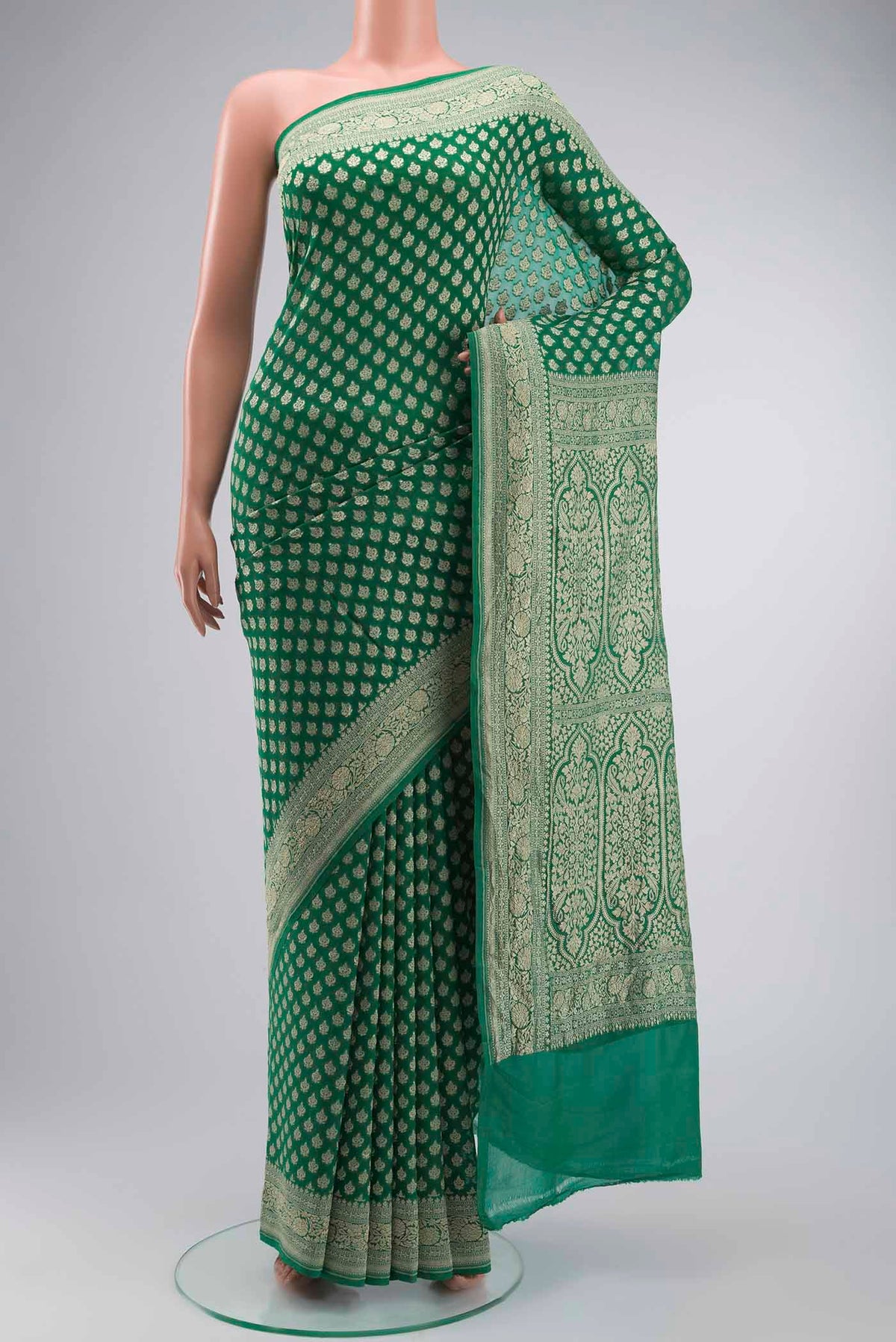 Green Banarasi Georgette Saree with Zari Butta on the body and Zari Border displayed on a mannequin