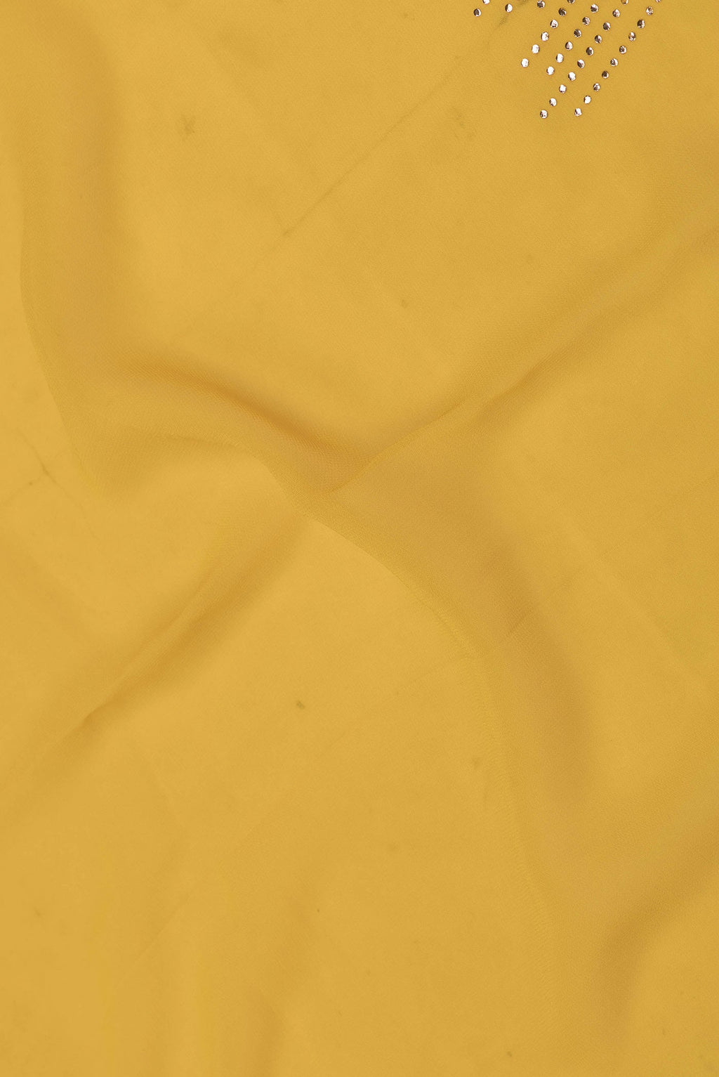 Close up of Yellow Dual Tone Georgette Saree with Embroidery on the body and Embroidery Border displaying folds
