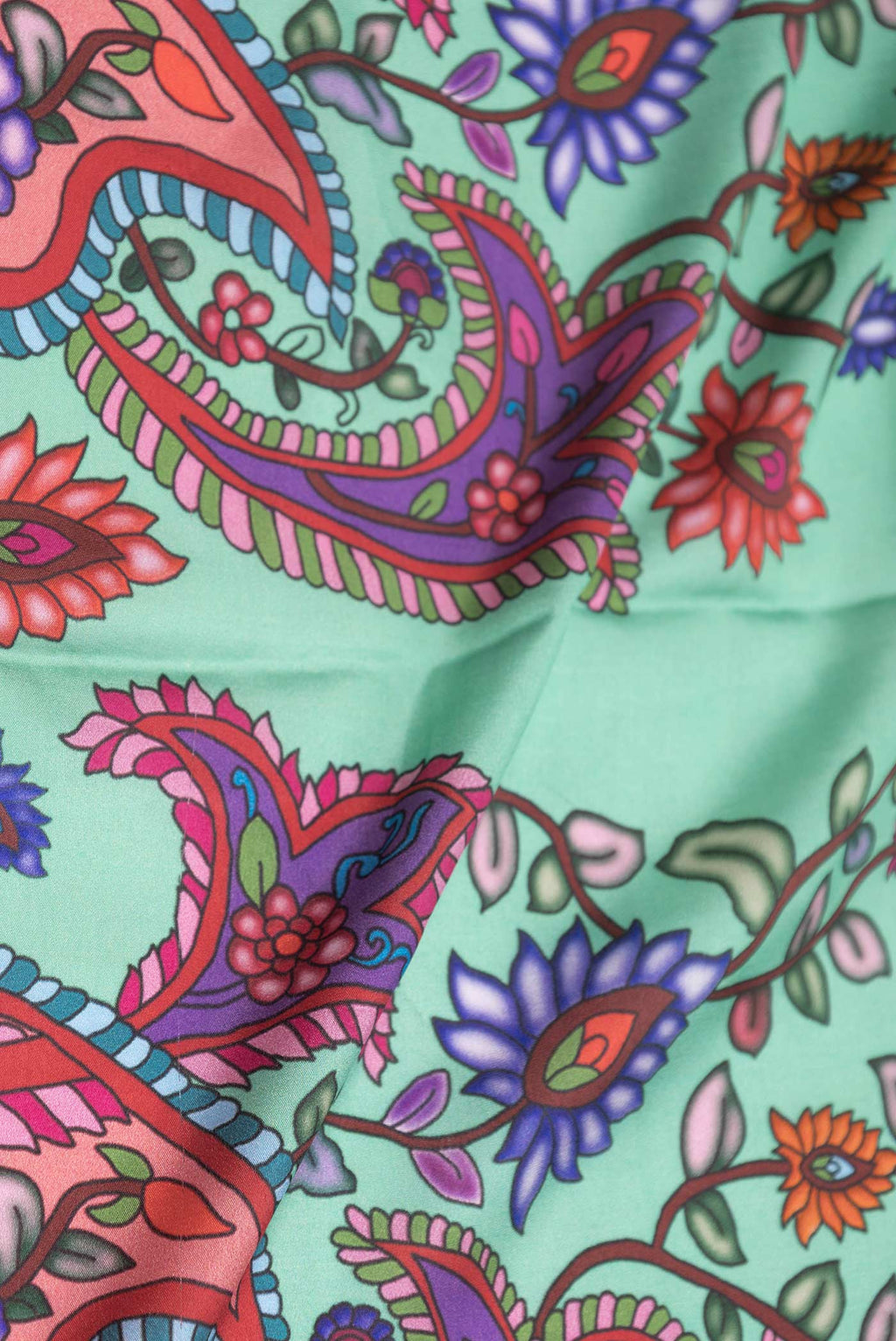 Close up of Sea Green Dual Tone Mysore Crepe Saree with Printed design on the body and Zari Border displaying folds