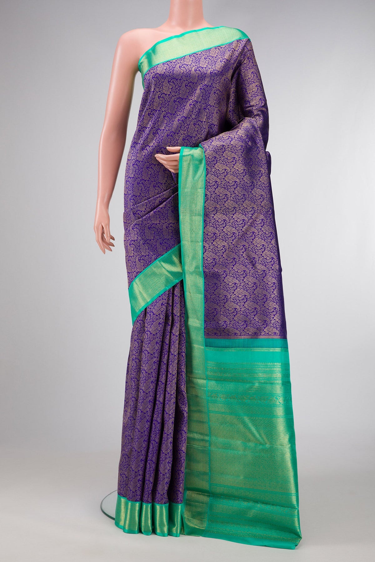 Pure Silk Pure Zari Royal Blue Dual Tone Kanjivaram Saree with Zari Brocade on the body and Zari Border.  displayed on a mannequin