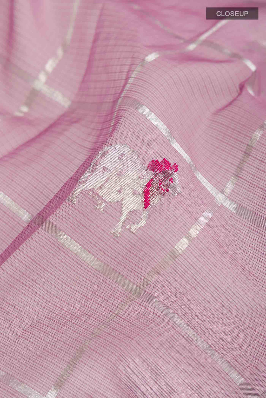 Close up of Lavender Kota Silk Saree with Zari And Thread Butta on the body and Zari Border displaying folds