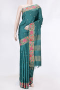 Peacock Blue Dual Tone Tussar Saree with Zari Butta on the body and Embroidery Border displayed on a mannequin