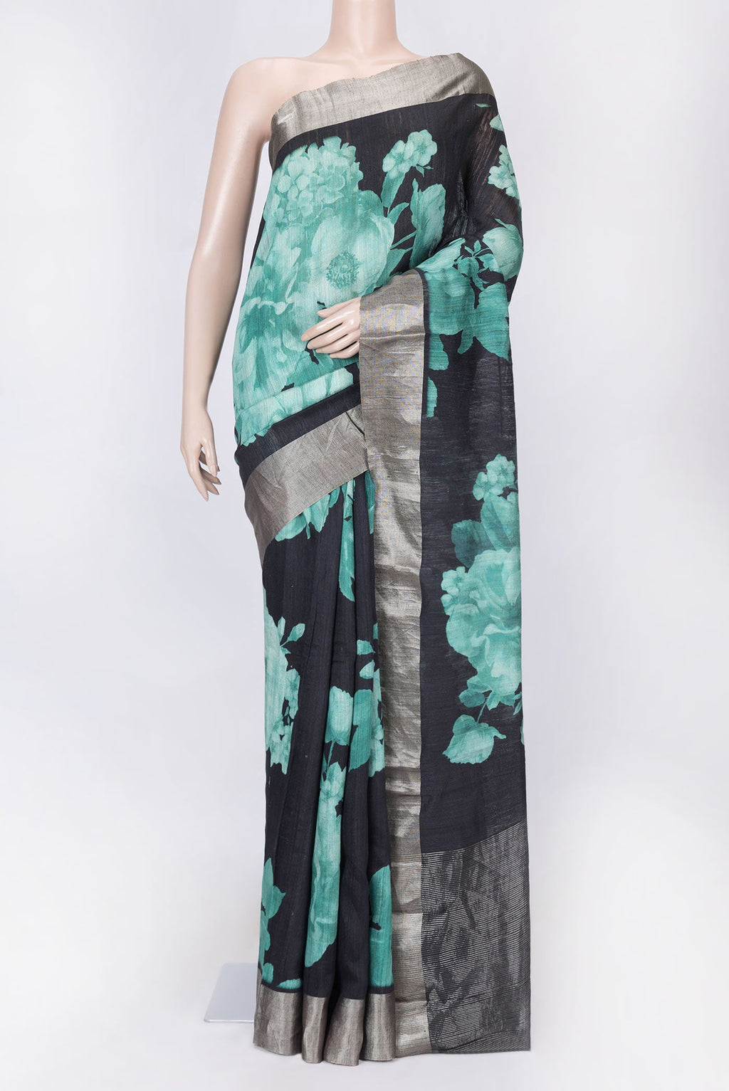 Black Dual Tone Tussar Silk Saree with Printed design on the body and Zari Border displayed on a mannequin