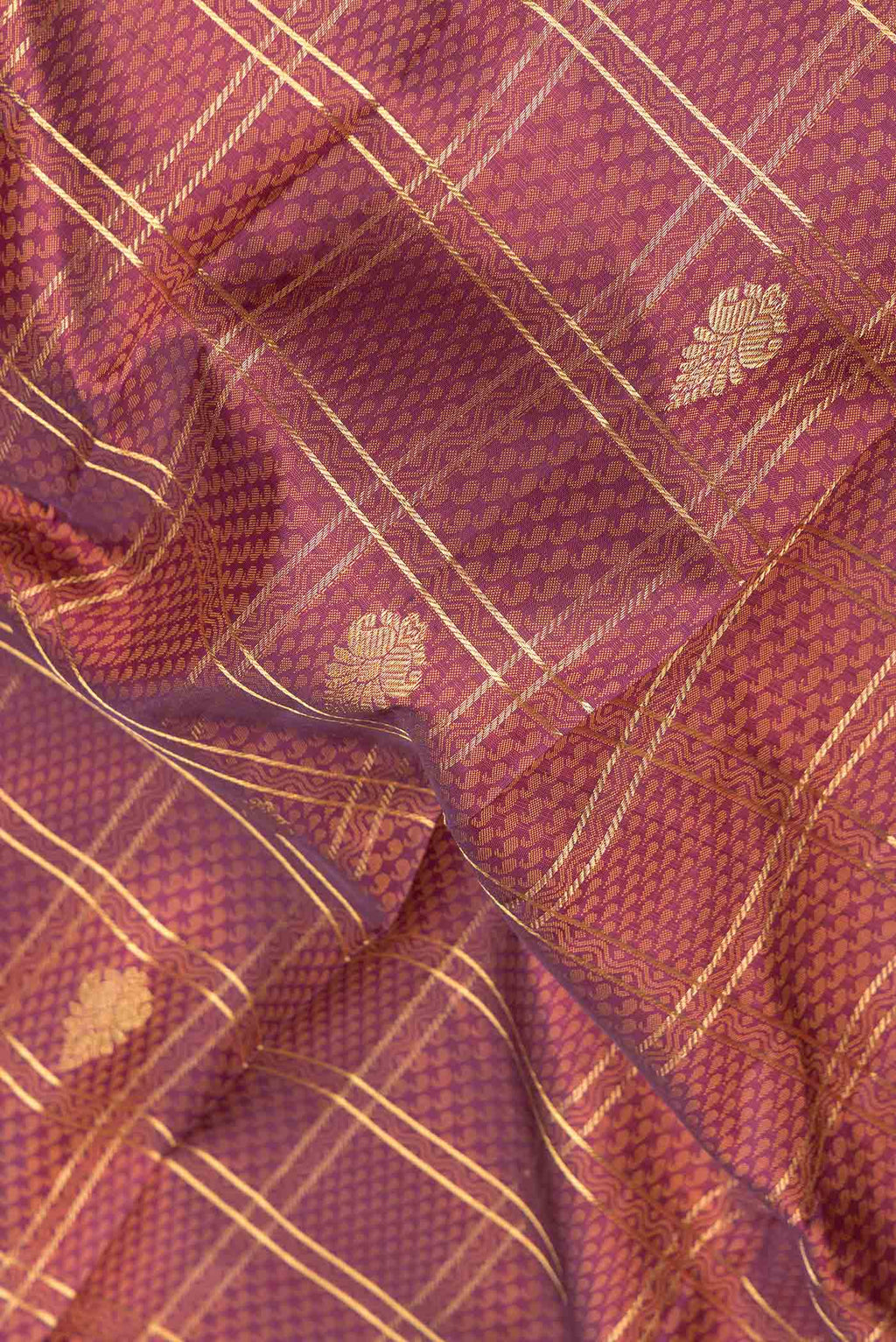 Close up of Purple Dual Tone Kanchipuram Silk Saree with Jacquard With Zari Butta on the body and Zari Border displaying folds