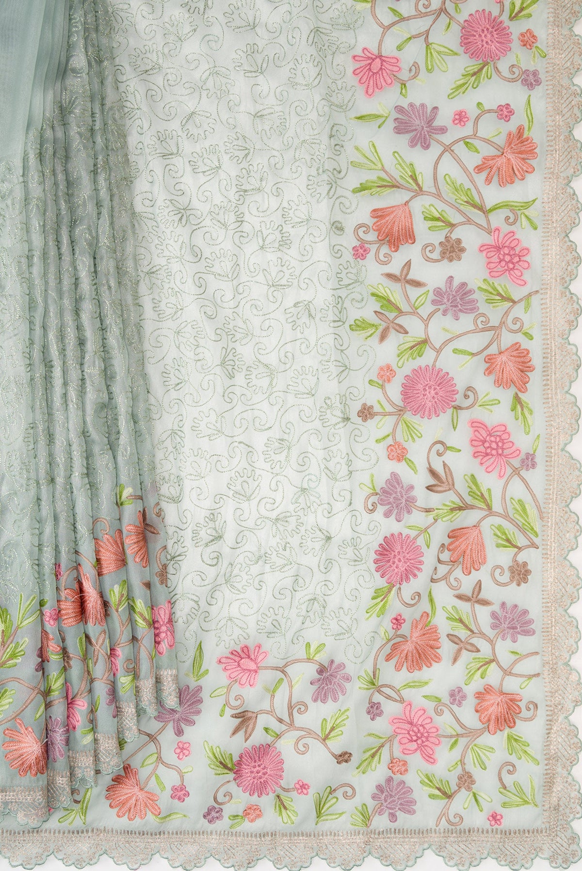 Pleats and pallu of Light Green Dual Tone Organza Silk Saree with Embroidery on the body and Embroidery Border. 