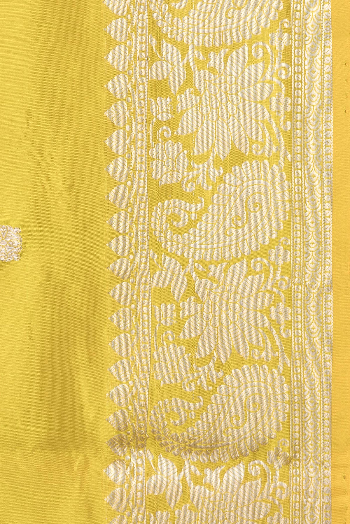 Border image of Yellow Dual Tone Banarasi Silk Saree with Zari Butta on the body and Zari Border. 