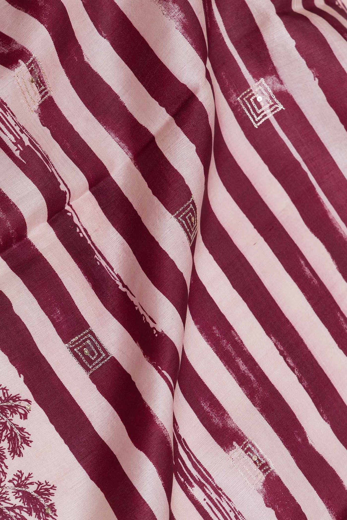Close up of Pink Dual Tone Tussar Silk SareePrinted design on the body and Plain Border displaying folds