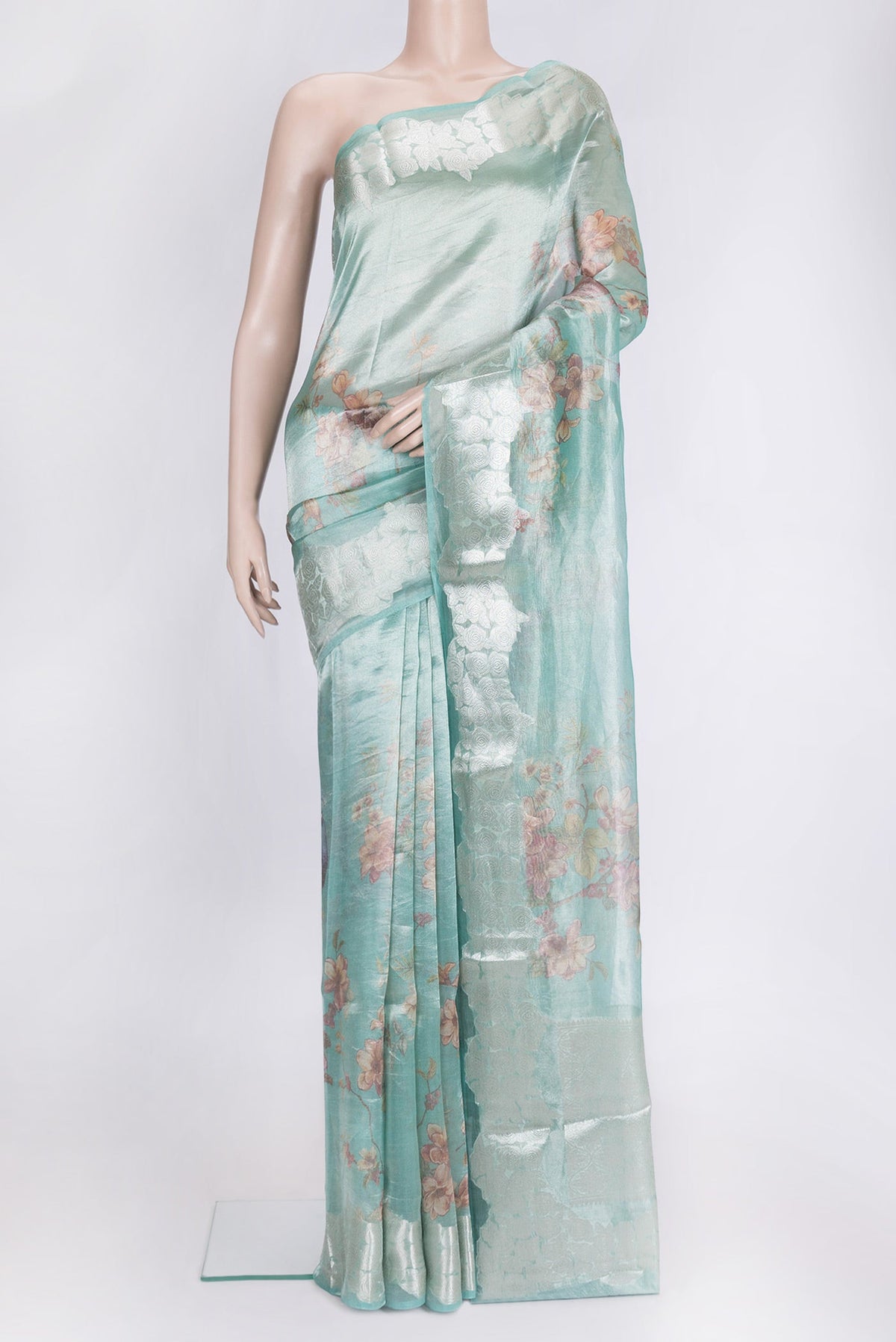 Sky Blue Dual Tone Organza Silk Saree with Printed design on the body and Zari Border.  displayed on a mannequin