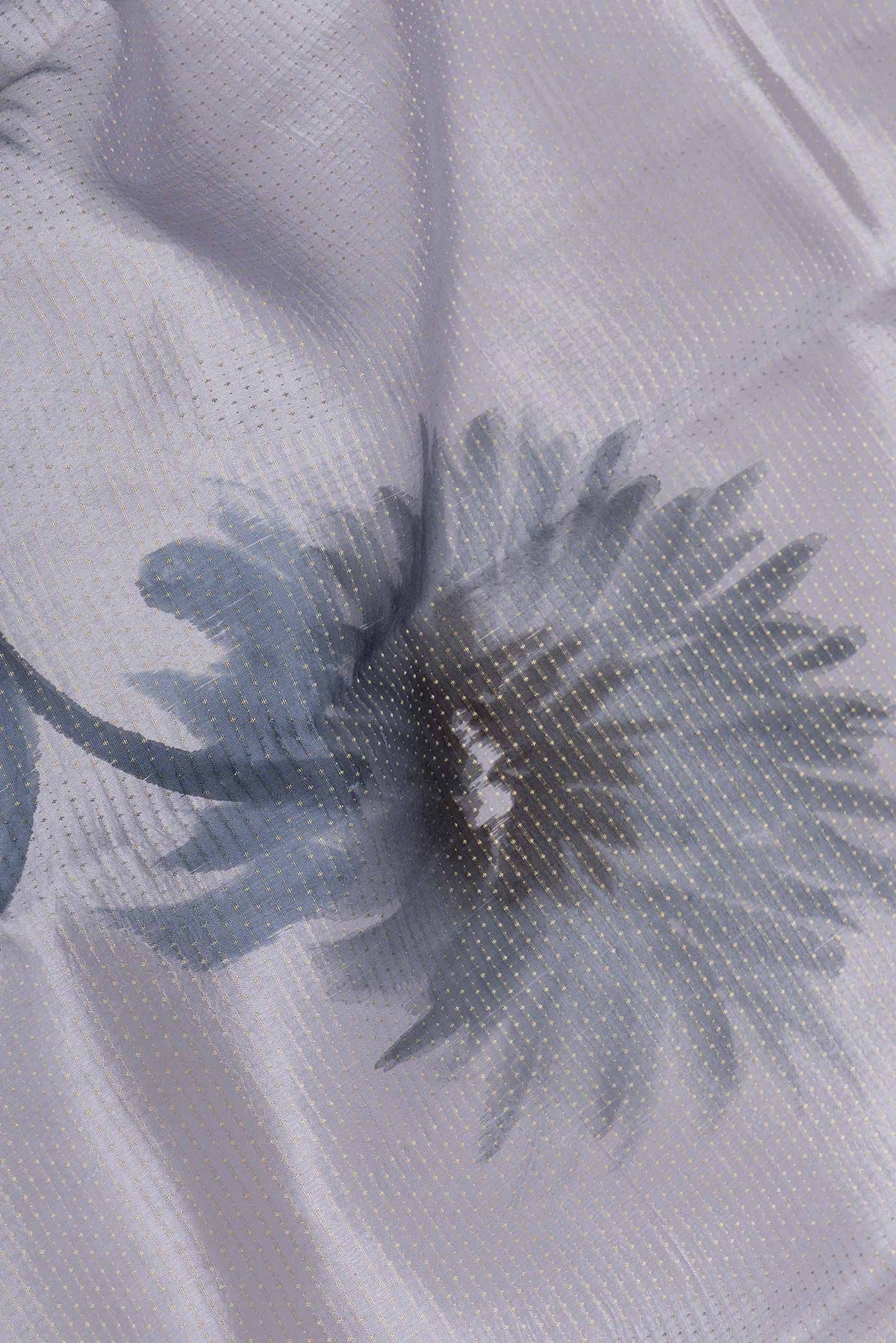 Close up of Grey Dual Tone Tussar Saree with Stripes on the body and Zari And Thread Border displaying folds