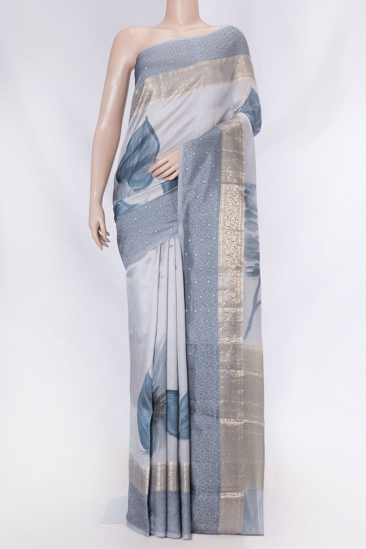 Grey Dual Tone Tussar Saree with Stripes on the body and Zari And Thread Border displayed on a mannequin