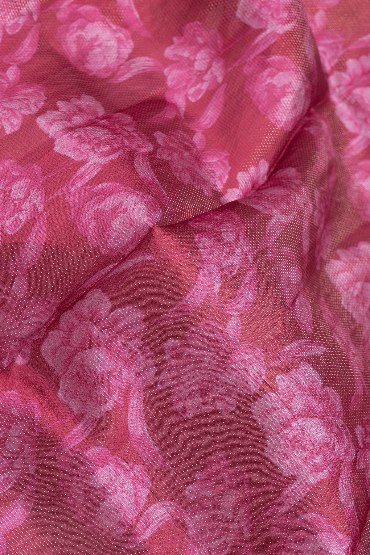 Close up of Maroon Dual Tone Tussar Silk Saree with Printed design on the body and Zari Border.  displaying folds