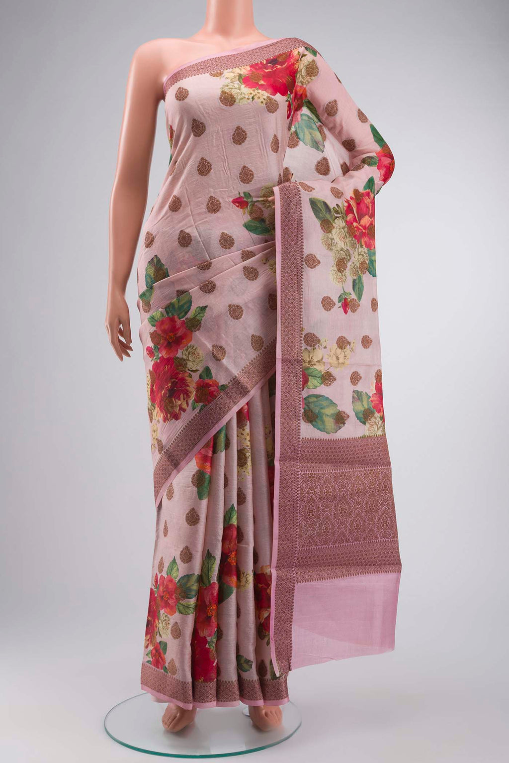 Rose pink Tussar Silk Saree with Printed design on the body and Zari Border displayed on a mannequin
