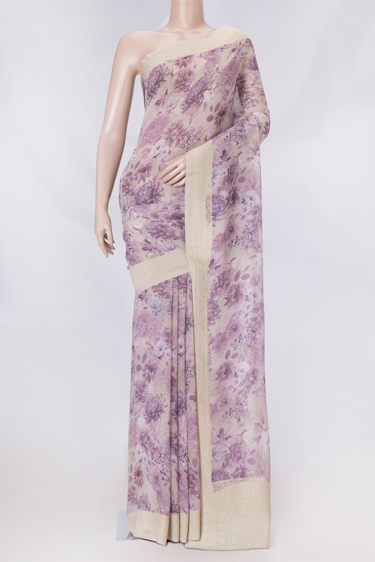 Golden Peach Dual Tone Georgette Saree with Printed design on the body and Zari Border displayed on a mannequin